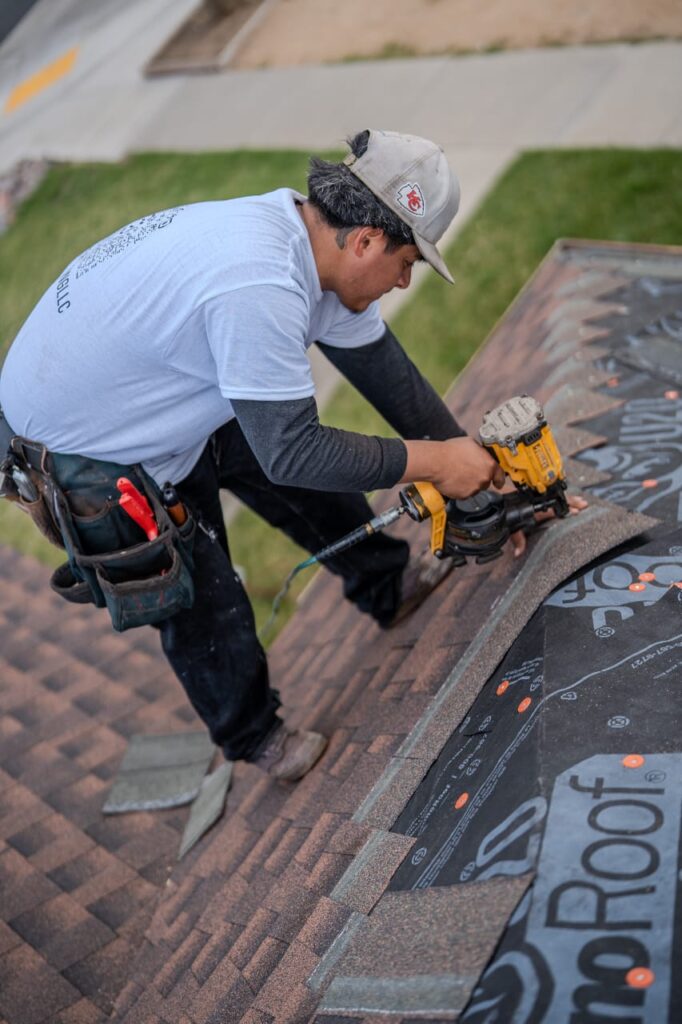 Licensed and insured roofing team with truck and equipment for commercial roofing project in Victorville