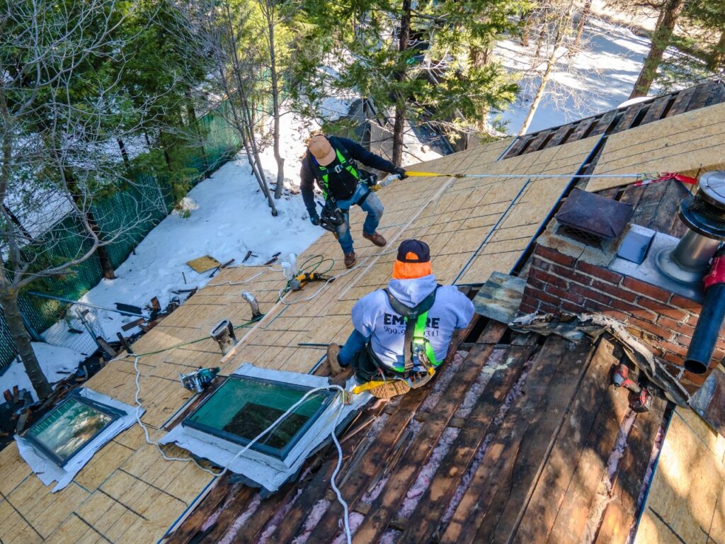 Experienced Victorville roofer repairing damaged roof tiles on High Desert home